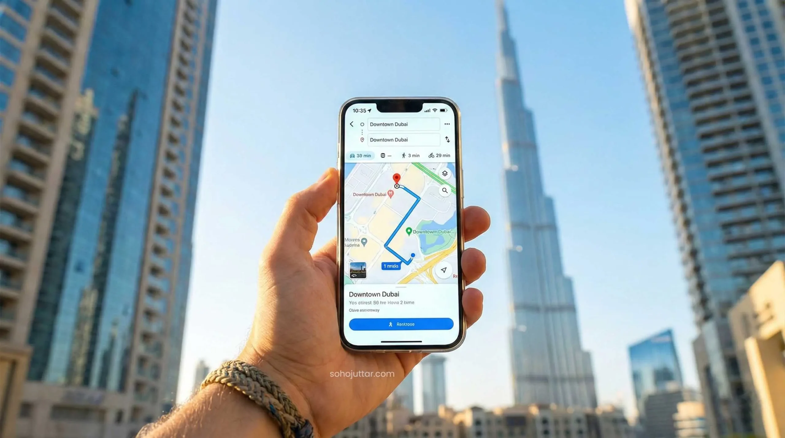 Tourist with connected smartphone navigating in front of Burj Khalifa Dubai